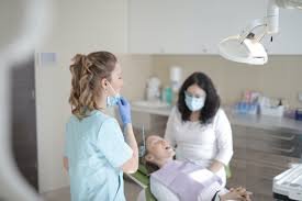 Female dentists working with patient in modern clinic · Free Stock ...