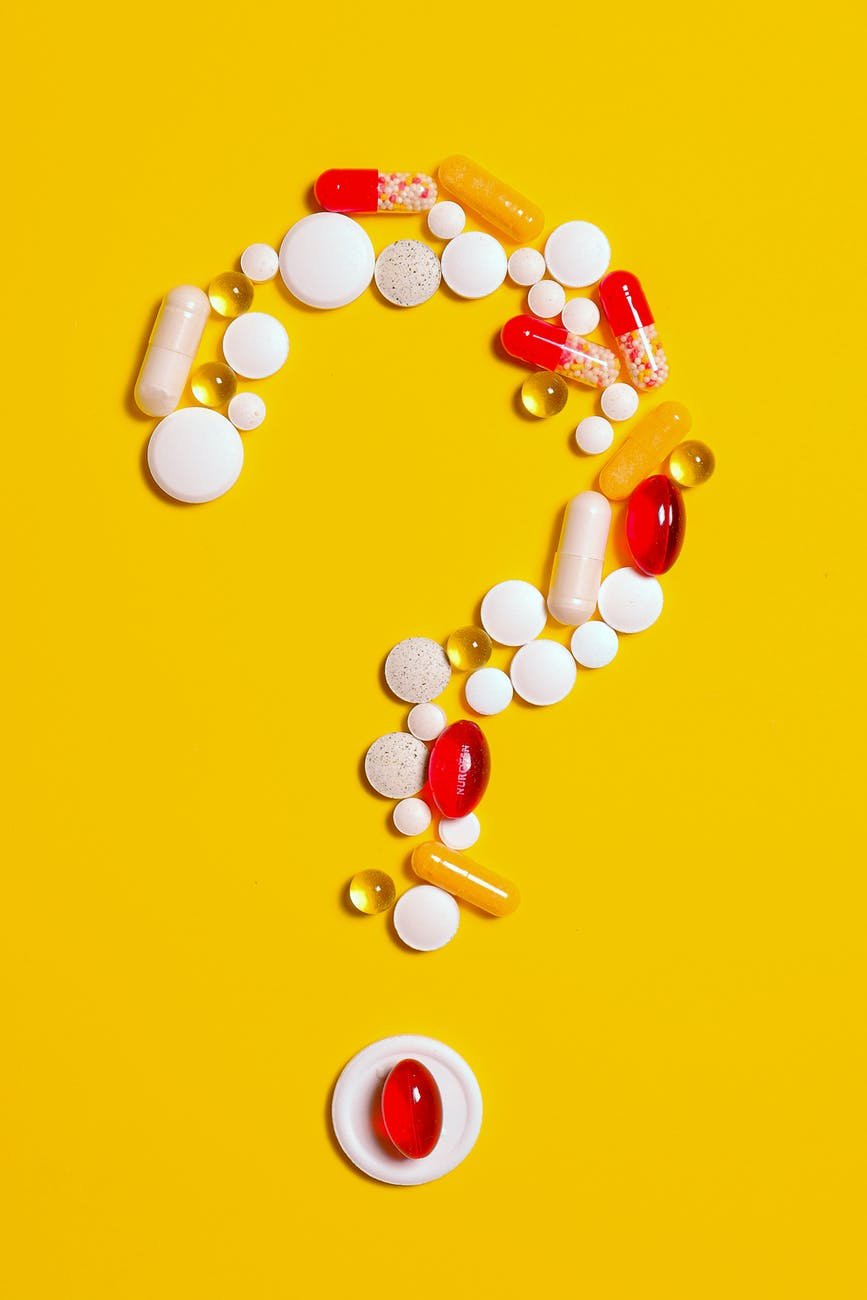 medication pills isolated on yellow background